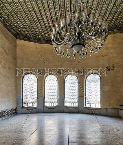 Interior of SabilÂ (Place providing free drinking water to pedestrians and animals in old Egypt) with iron ornate windows, white marble floor, and huge chandelier. part of the mosque of Soliman Agha El-Selehdar, Cairo, Egypt